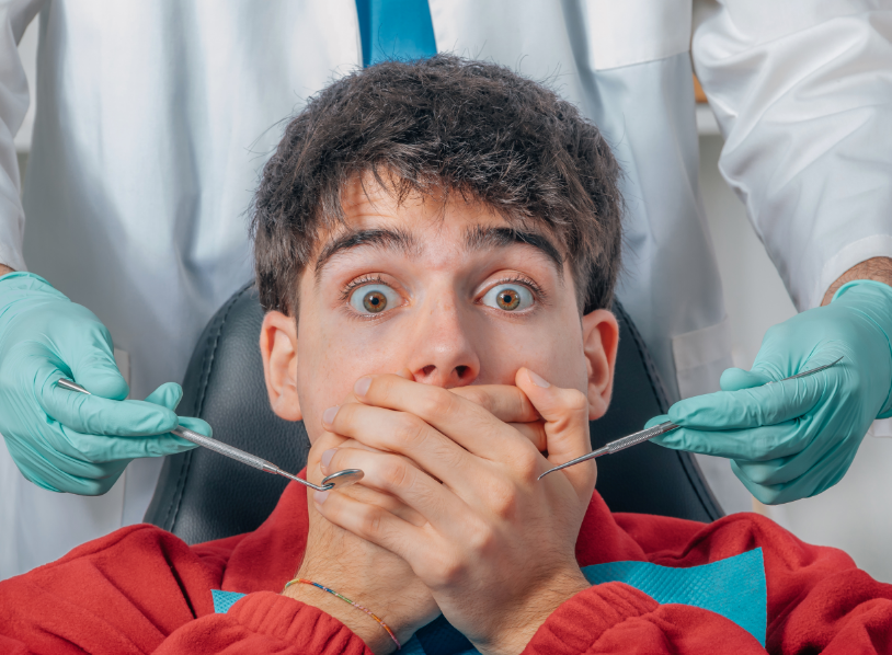 Man looking afraid at dental appointment